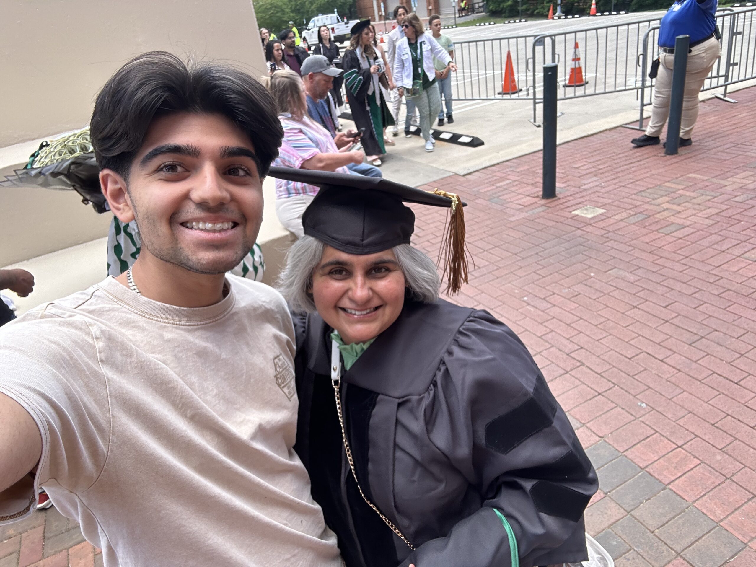 Armaan Raina, Caldwell Class of 2026, with his mother and leadership role model at her PhD graduation.