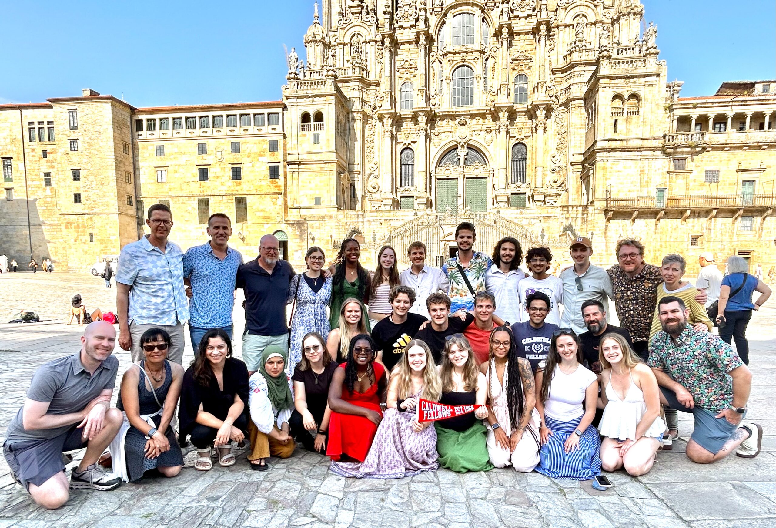 A group of people in front of the Cathedral in Santiago de Compostela, Spain.